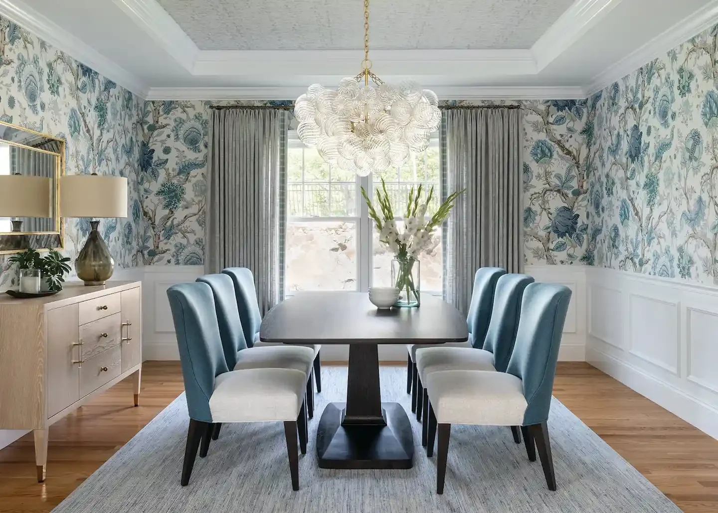 A light blue floral pattern across the walls of a dining room